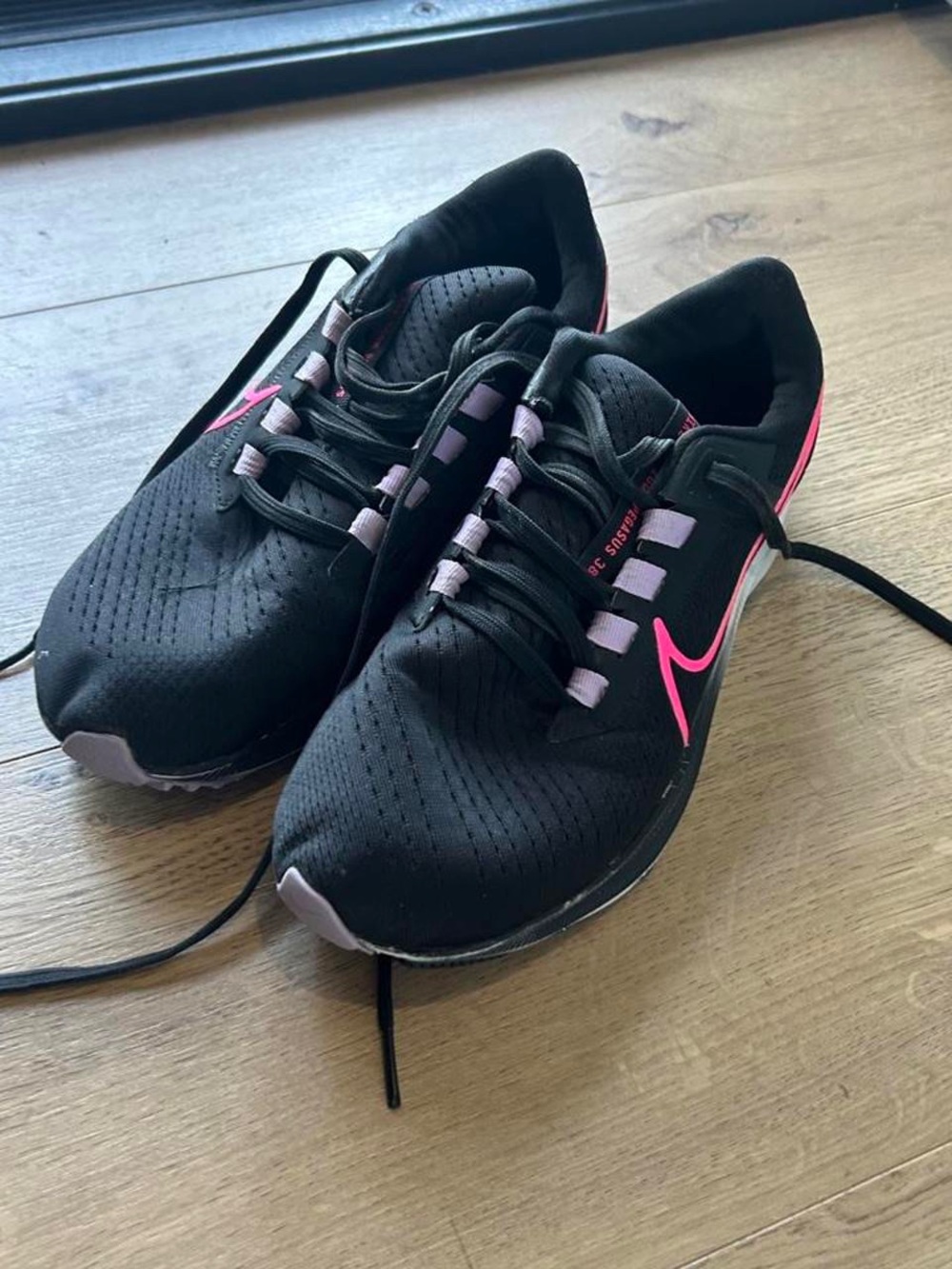 Nike Women's Black Running Shoes with Pink and Lavender Accents